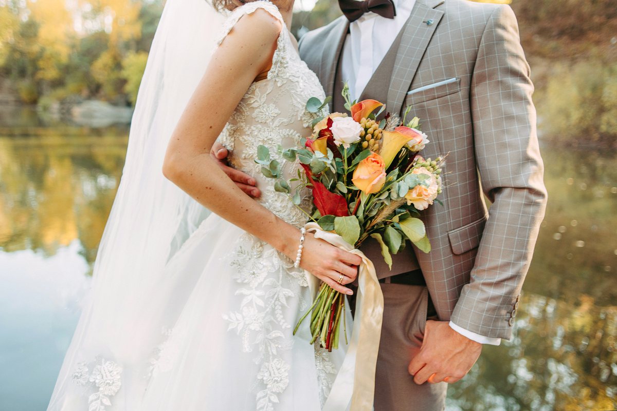 A couple holding their bouquet, finished in the Warm Editorial look