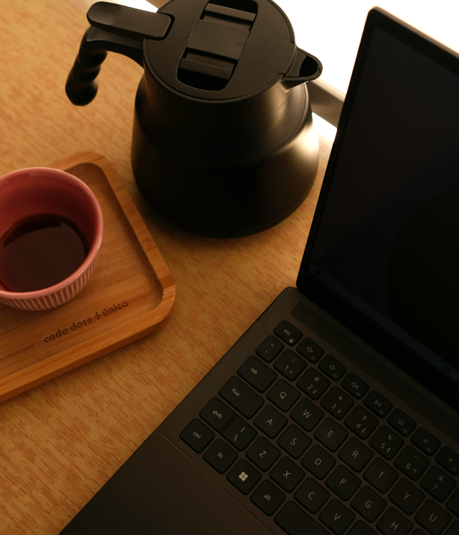 The editing desk — coffee, kettle, and a laptop mid-edit